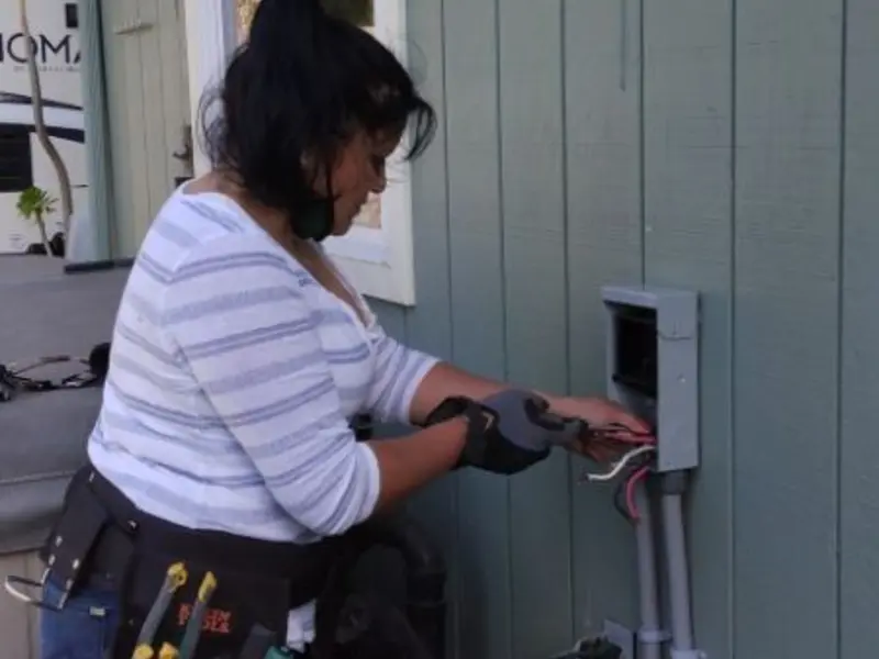 Licensed electrician wiring an exterior subpanel in Martha Lake
