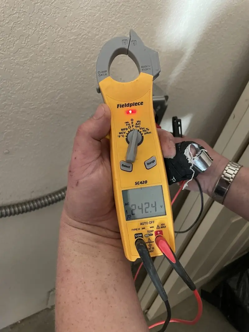 Voltage testing with clamp meter during Electrical Installation Services in Martha Lake